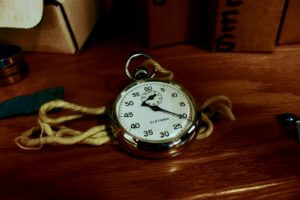 vintage watch jewelry sitting on wooden table