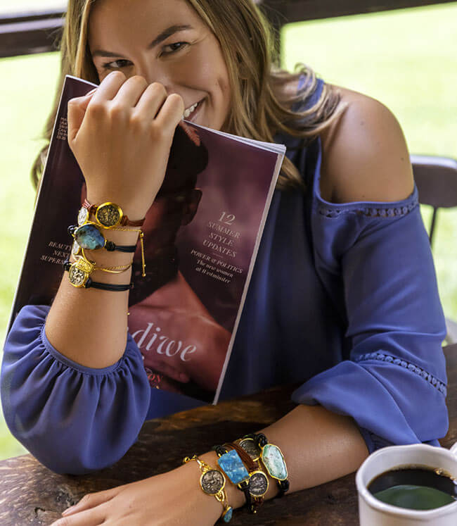 female wearing custom designed bracelets with turquoise and ancient coins